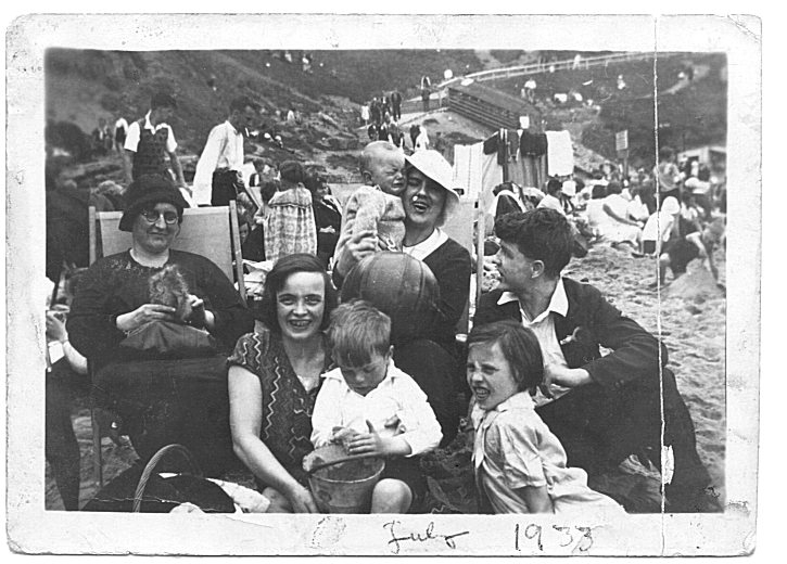 A photograph taken in 1933 of a family at the beach